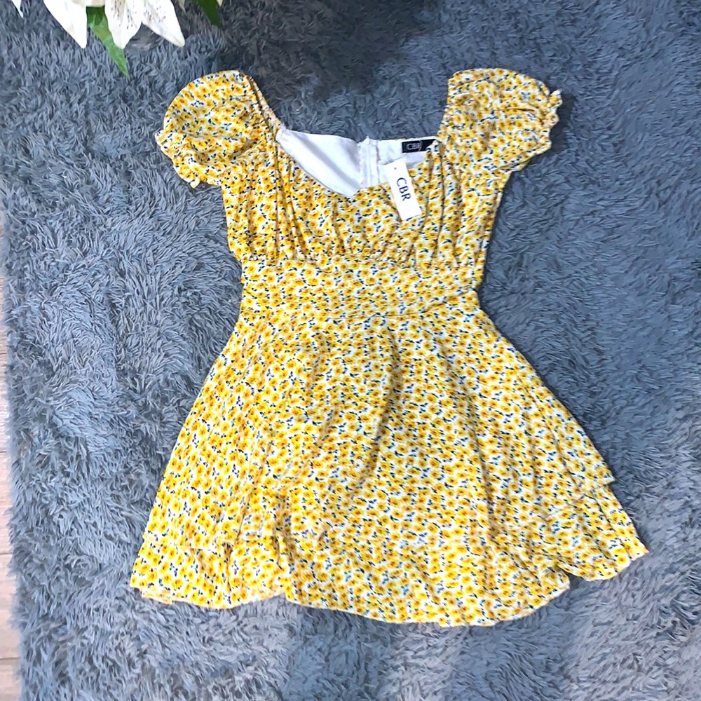 Short, yellow colored, flowered print dress